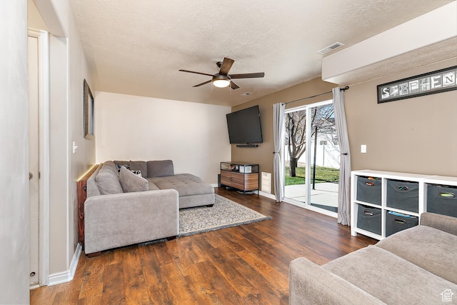 6874 S Hoyle Cir, West Jordan, UT 84081 - living area with wood finished floors, a textured ceiling, baseboards, visible vents, and ceiling fan