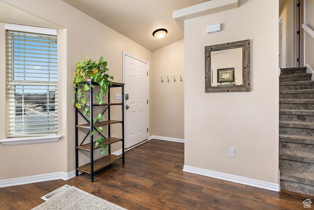 6874 S Hoyle Cir, West Jordan, UT 84081 - entryway featuring baseboards, visible vents, stairs, and dark wood-type flooring