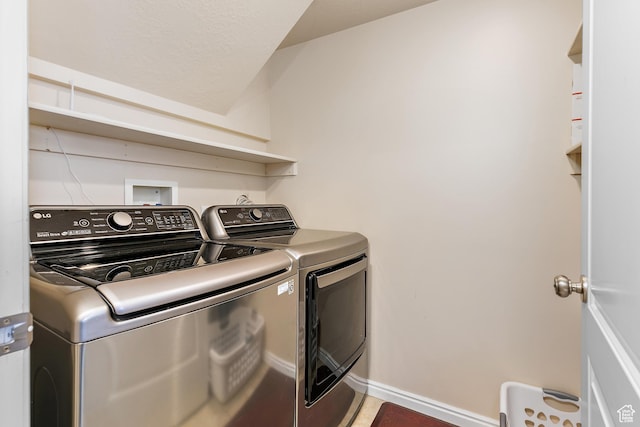 6874 S Hoyle Cir, West Jordan, UT 84081 - clothes washing area with baseboards, laundry area, and separate washer and dryer
