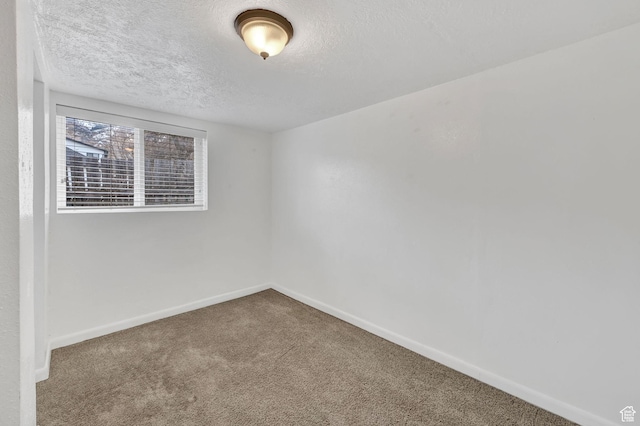 150 E 200 S, Providence, UT 84332 - empty room with a textured ceiling, baseboards, and carpet floors