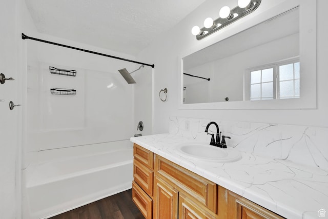 150 E 200 S, Providence, UT 84332 - bathroom with bathtub / shower combination, vanity, and wood finished floors
