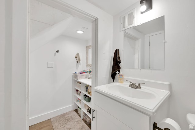 150 E 200 S, Providence, UT 84332 - bathroom featuring vanity, visible vents, toilet, wood finished floors, and baseboards