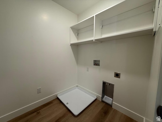 washroom featuring hookup for an electric dryer, hookup for a washing machine, baseboards, dark wood-type flooring, and laundry area