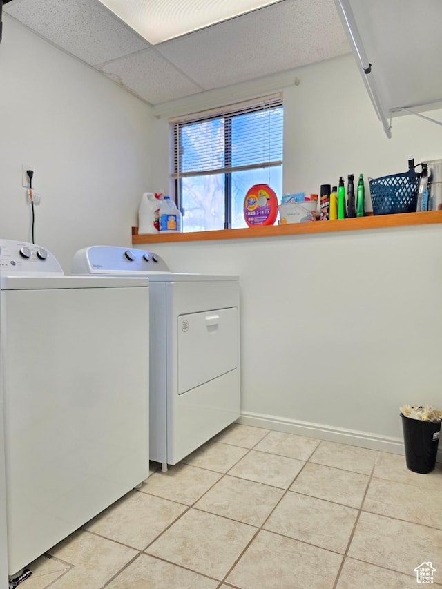 243 Downs Cir, Ogden, UT 84404 - laundry room with light tile patterned floors, washer and clothes dryer, baseboards, and laundry area