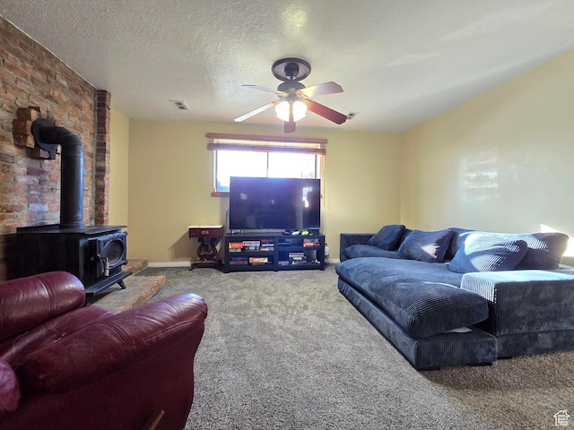 243 Downs Cir, Ogden, UT 84404 - living area with a wood stove, a textured ceiling, carpet floors, visible vents, and ceiling fan