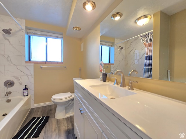 243 Downs Cir, Ogden, UT 84404 - full bathroom with toilet, vanity, shower / bath combo, wood finished floors, and baseboards
