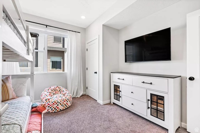 875 W Akoya Pearl St S Unit 101-B, St George, UT 84790 - living area featuring light carpet and baseboards