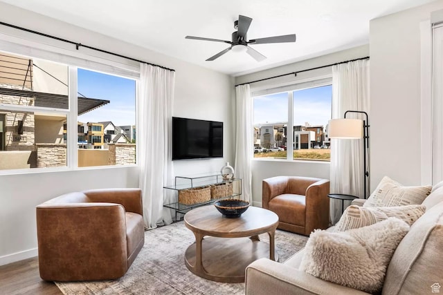 875 W Akoya Pearl St S Unit 101-B, St George, UT 84790 - living area with wood finished floors, baseboards, and a ceiling fan