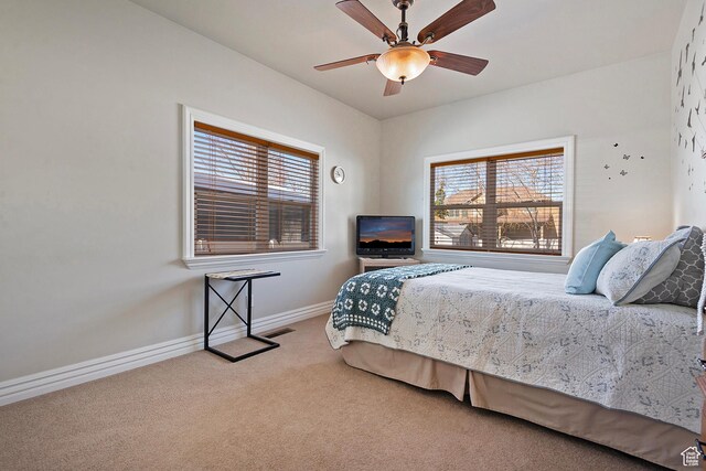 3173 N 1050 W, Pleasant View, UT 84414 - carpeted bedroom with visible vents, baseboards, multiple windows, and ceiling fan