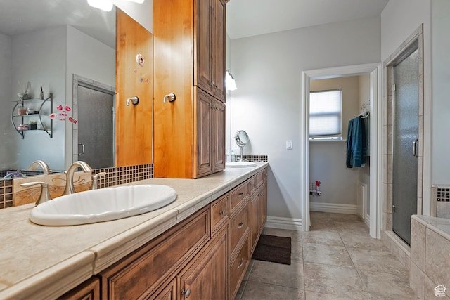 3173 N 1050 W, Pleasant View, UT 84414 - full bathroom with double vanity, a sink, a stall shower, and baseboards