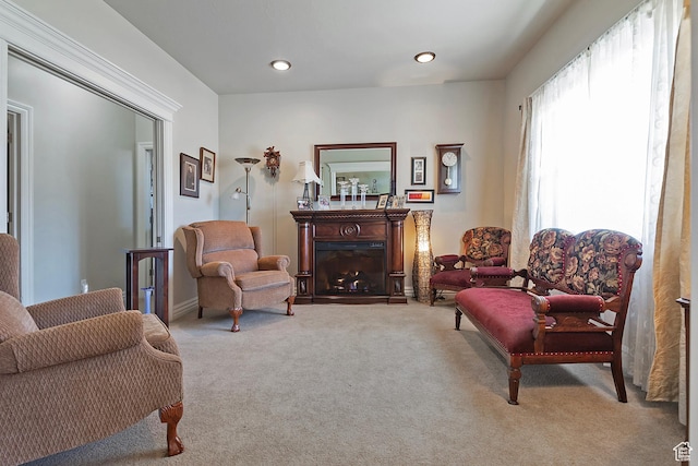 3173 N 1050 W, Pleasant View, UT 84414 - living area featuring a warm lit fireplace, carpet, and recessed lighting