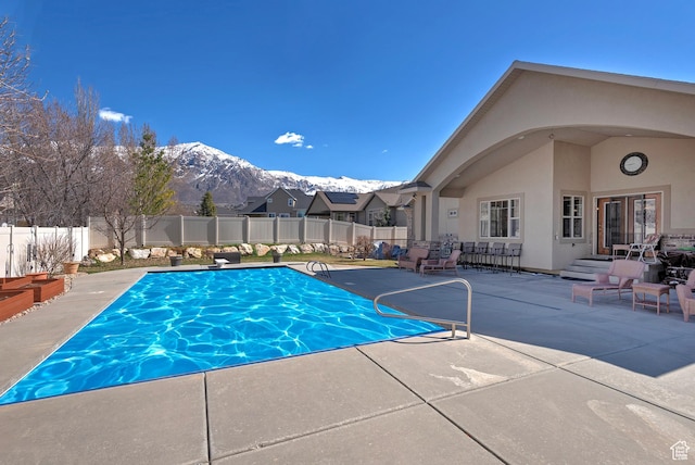 3173 N 1050 W, Pleasant View, UT 84414 - view of swimming pool with a mountain view, a fenced backyard, french doors, and a patio area
