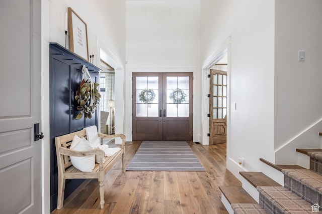 1230 S Eaglenest Dr, Woodland Hills, UT 84653 - entryway featuring french doors, light wood-style floors, stairway, a high ceiling, and baseboards