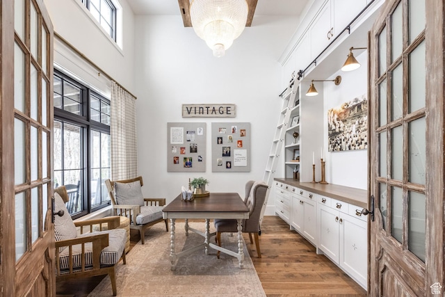 1230 S Eaglenest Dr, Woodland Hills, UT 84653 - office area featuring a high ceiling and wood finished floors