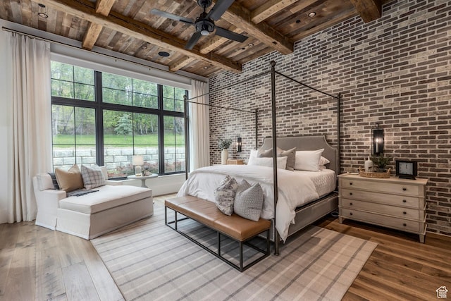 1230 S Eaglenest Dr, Woodland Hills, UT 84653 - bedroom with brick wall, wooden ceiling with exposed beams, hardwood / wood-style flooring, a towering ceiling, and multiple windows