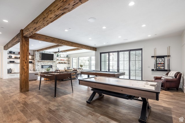 1230 S Eaglenest Dr, Woodland Hills, UT 84653 - recreation room featuring recessed lighting, wood finished floors, beamed ceiling, a stone fireplace, and ceiling fan