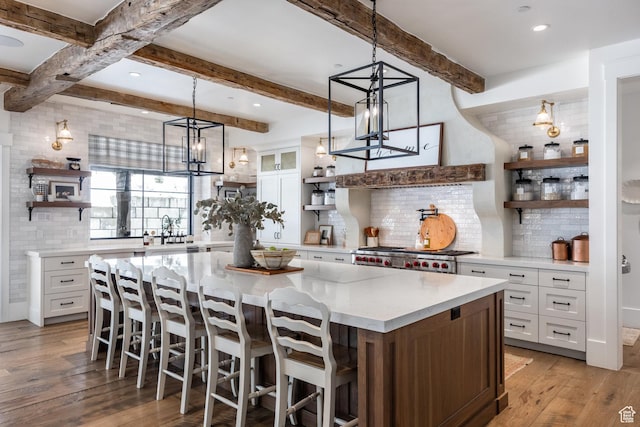 1230 S Eaglenest Dr, Woodland Hills, UT 84653 - kitchen featuring open shelves, tasteful backsplash, range, white cabinetry, and beamed ceiling