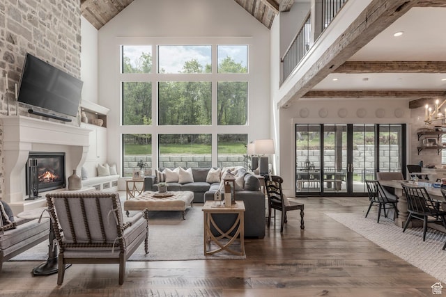 1230 S Eaglenest Dr, Woodland Hills, UT 84653 - living room featuring a high ceiling, a large fireplace, wood-type flooring, and plenty of natural light