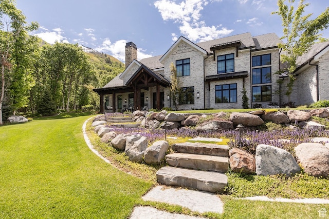 1230 S Eaglenest Dr, Woodland Hills, UT 84653 - view of front of house with a chimney and a front yard
