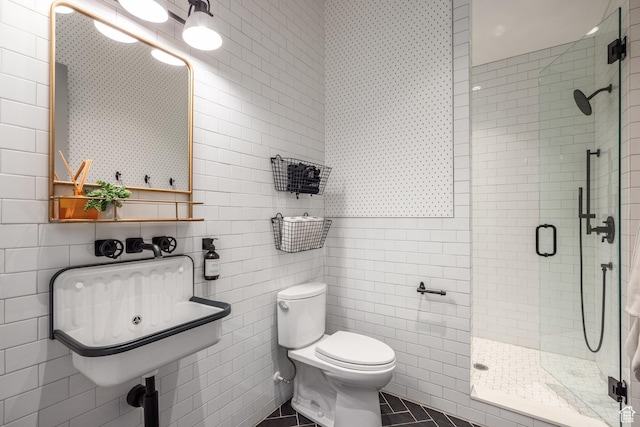 1230 S Eaglenest Dr, Woodland Hills, UT 84653 - bathroom featuring a shower stall, toilet, tile walls, and tile patterned flooring