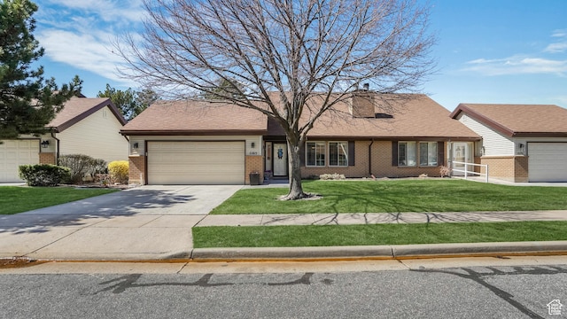 ranch-style house featuring roof with shingles, driveway, a front yard, brick siding, and a garage