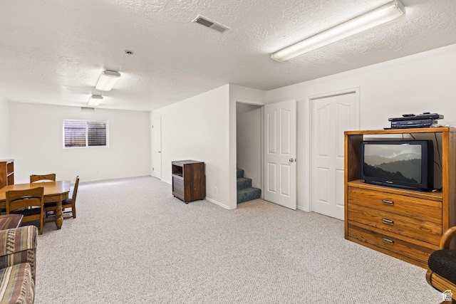 430 E Canyon Rd, Fillmore, UT 84631 - carpeted living area featuring baseboards, visible vents, stairway, and a textured ceiling