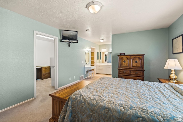 430 E Canyon Rd, Fillmore, UT 84631 - carpeted bedroom with a textured wall, baseboards, a textured ceiling, ensuite bath, and visible vents