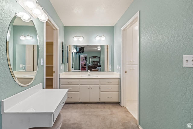 430 E Canyon Rd, Fillmore, UT 84631 - bathroom featuring ensuite bath, a textured wall, and vanity
