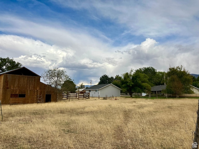 430 E Canyon Rd, Fillmore, UT 84631 - view of yard featuring fence, an outdoor structure, and a barn