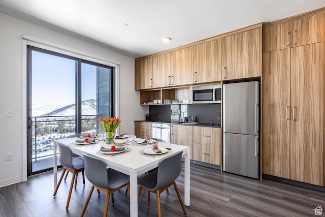 2670 W Canyons Resort Dr Unit 437, Park City, UT 84098 - dining space featuring a mountain view, baseboards, and dark wood-type flooring