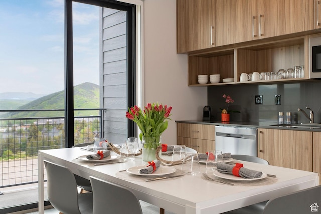 2670 W Canyons Resort Dr Unit 437, Park City, UT 84098 - kitchen featuring modern cabinets, a sink, appliances with stainless steel finishes, a mountain view, and light brown cabinets