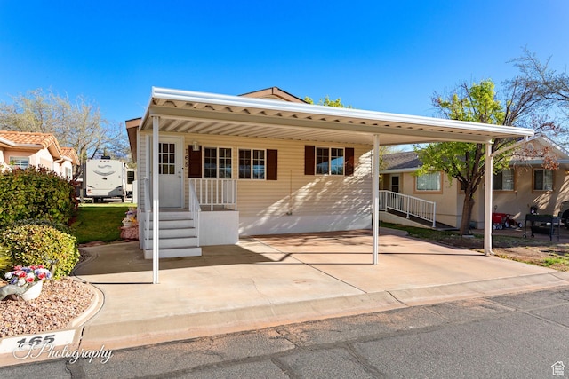 180 N 1100 E Unit 165, Washington, UT 84780 - manufactured / mobile home featuring a carport