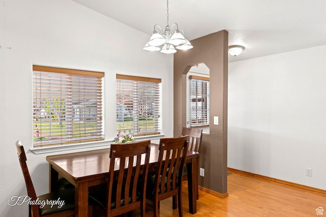 180 N 1100 E Unit 165, Washington, UT 84780 - dining room featuring baseboards, arched walkways, a notable chandelier, and light wood finished floors