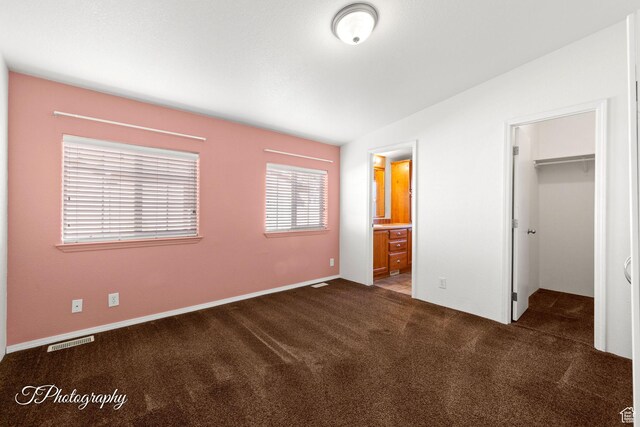 180 N 1100 E Unit 165, Washington, UT 84780 - unfurnished bedroom featuring connected bathroom, a closet, carpet flooring, a walk in closet, and visible vents