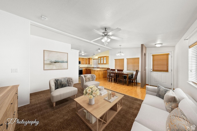 180 N 1100 E Unit 165, Washington, UT 84780 - living room with light wood-style floors, vaulted ceiling, and ceiling fan