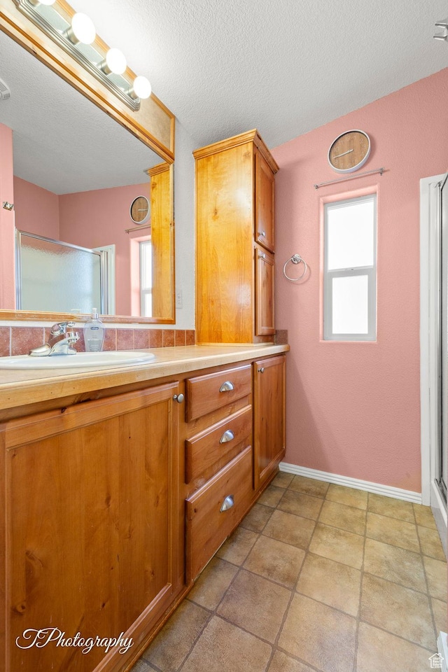 180 N 1100 E Unit 165, Washington, UT 84780 - bathroom featuring a healthy amount of sunlight, vanity, and a stall shower