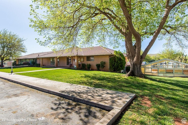 180 N 1100 E Unit 165, Washington, UT 84780 - view of front of home with stucco siding, a tile roof, and a front lawn