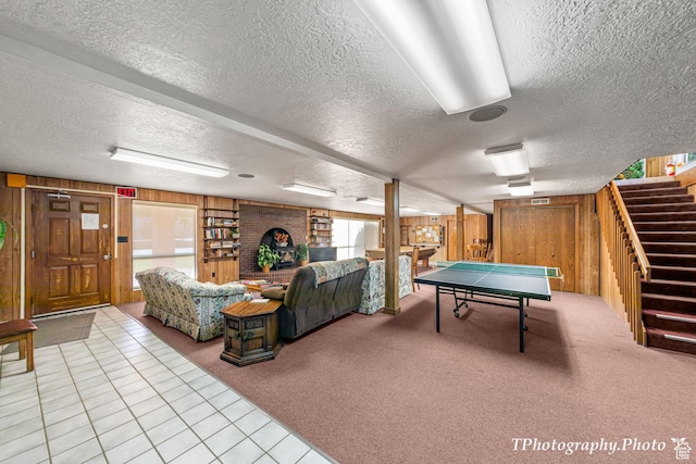 180 N 1100 E Unit 165, Washington, UT 84780 - rec room featuring light tile patterned flooring, a textured ceiling, wooden walls, and light carpet