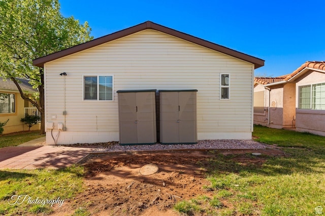 180 N 1100 E Unit 165, Washington, UT 84780 - rear view of house with a lawn and a patio