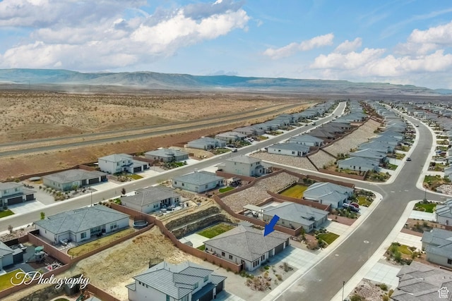 bird's eye view featuring a residential view and a mountain view