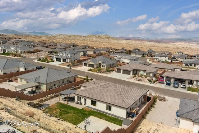 drone / aerial view with a mountain view and a residential view