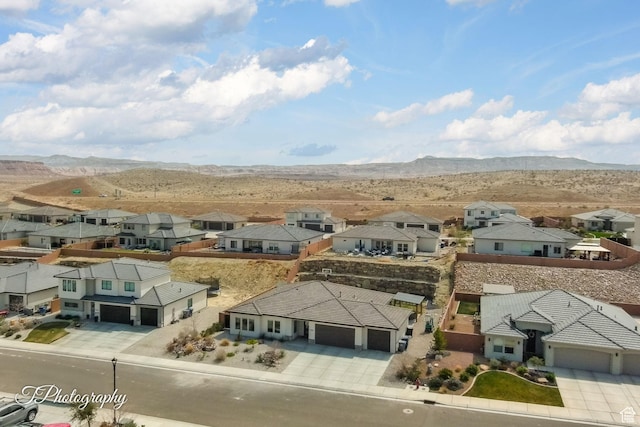 birds eye view of property featuring a mountain view and a residential view