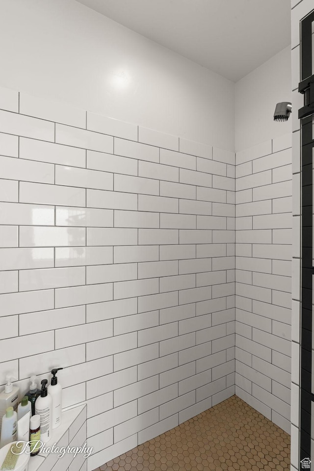full bathroom with tiled shower
