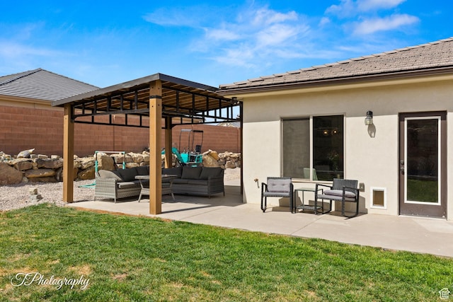 exterior space featuring stucco siding, a tiled roof, outdoor lounge area, a yard, and a patio area