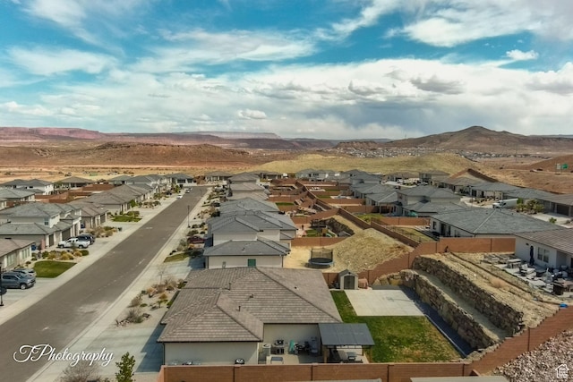 drone / aerial view featuring a residential view and a mountain view