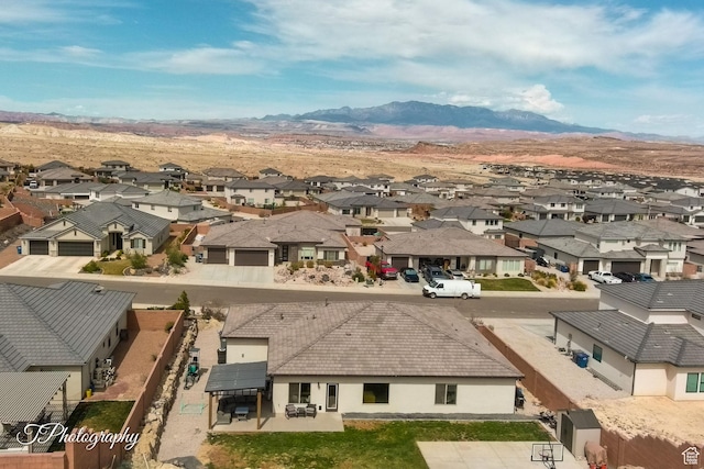 drone / aerial view featuring a mountain view and a residential view