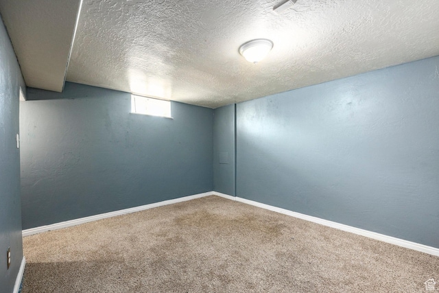 1150 W Girard Ave, Salt Lake City, UT 84116 - basement with baseboards, a textured ceiling, a textured wall, and carpet