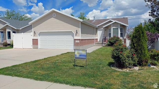 6116 W Graceland Way, West Jordan, UT 84081 - ranch-style house featuring brick siding, an attached garage, driveway, and roof with shingles