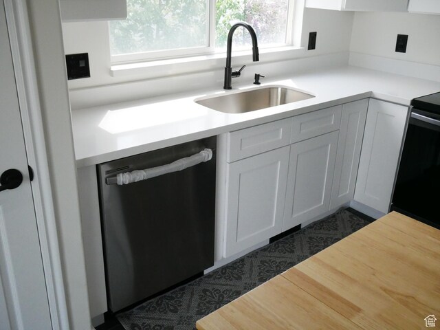 6116 W Graceland Way, West Jordan, UT 84081 - kitchen featuring dishwasher, healthy amount of natural light, light countertops, and a sink