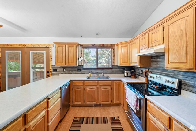 18509 Jefferson Ave, Eagle Mountain, UT 84013 - kitchen with stainless steel appliances, under cabinet range hood, a sink, light countertops, and lofted ceiling